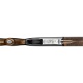 Dolna część stalowej baskili bocka myśliwskiego Benelli 828U Limited Edition, prezentująca precyzyjny pojedynczy spust o oporze 1600 g oraz grawerunki charakterystyczne dla limitowanej serii.